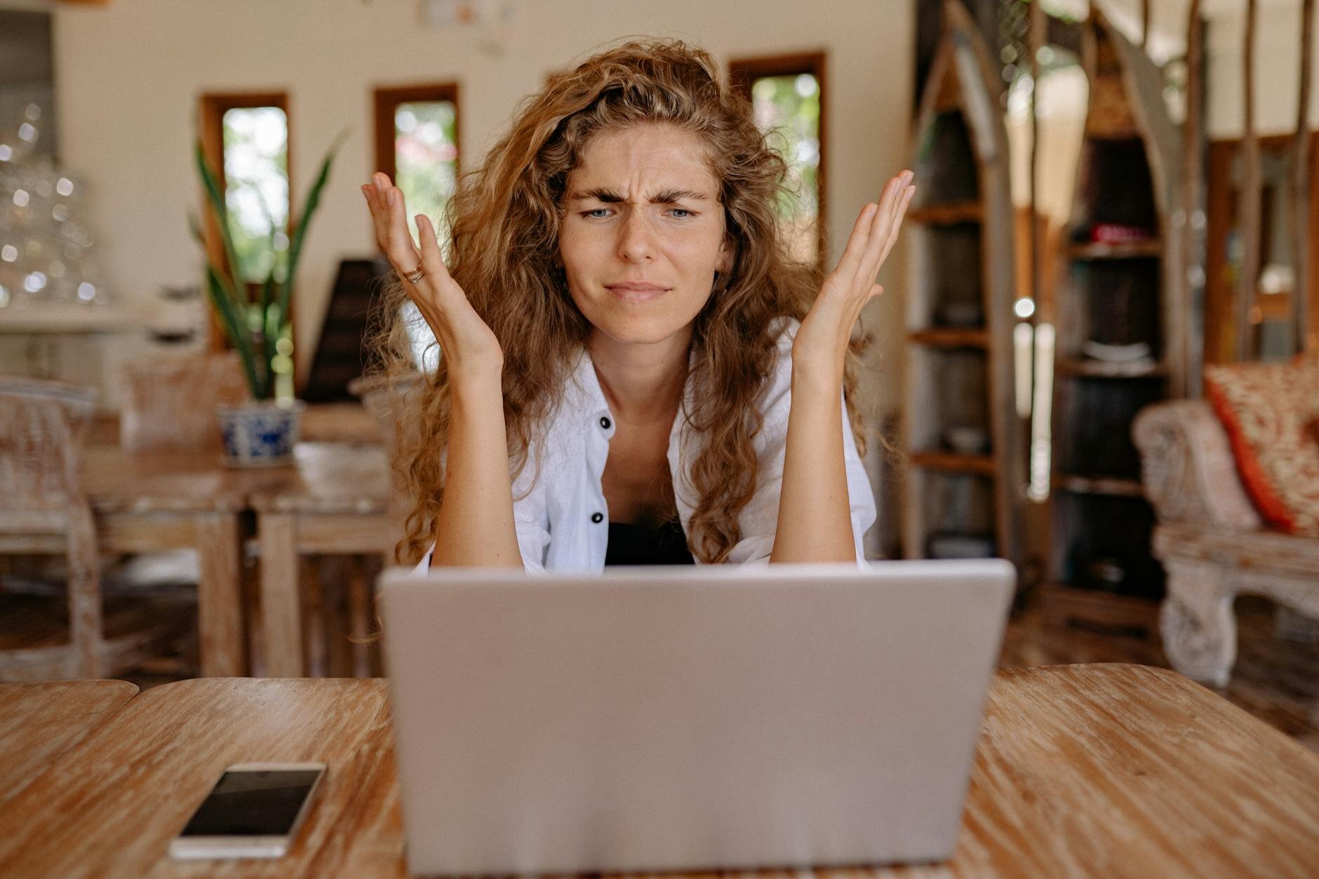 Woman at computer trying to figure out why her monthly mortgage payment went up or changed.