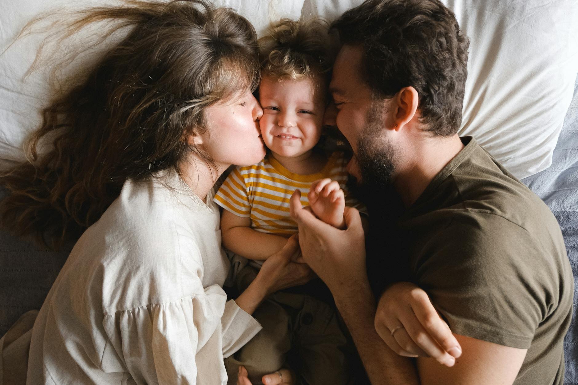 A happy family learn about the different types of refinances they can do with their home.