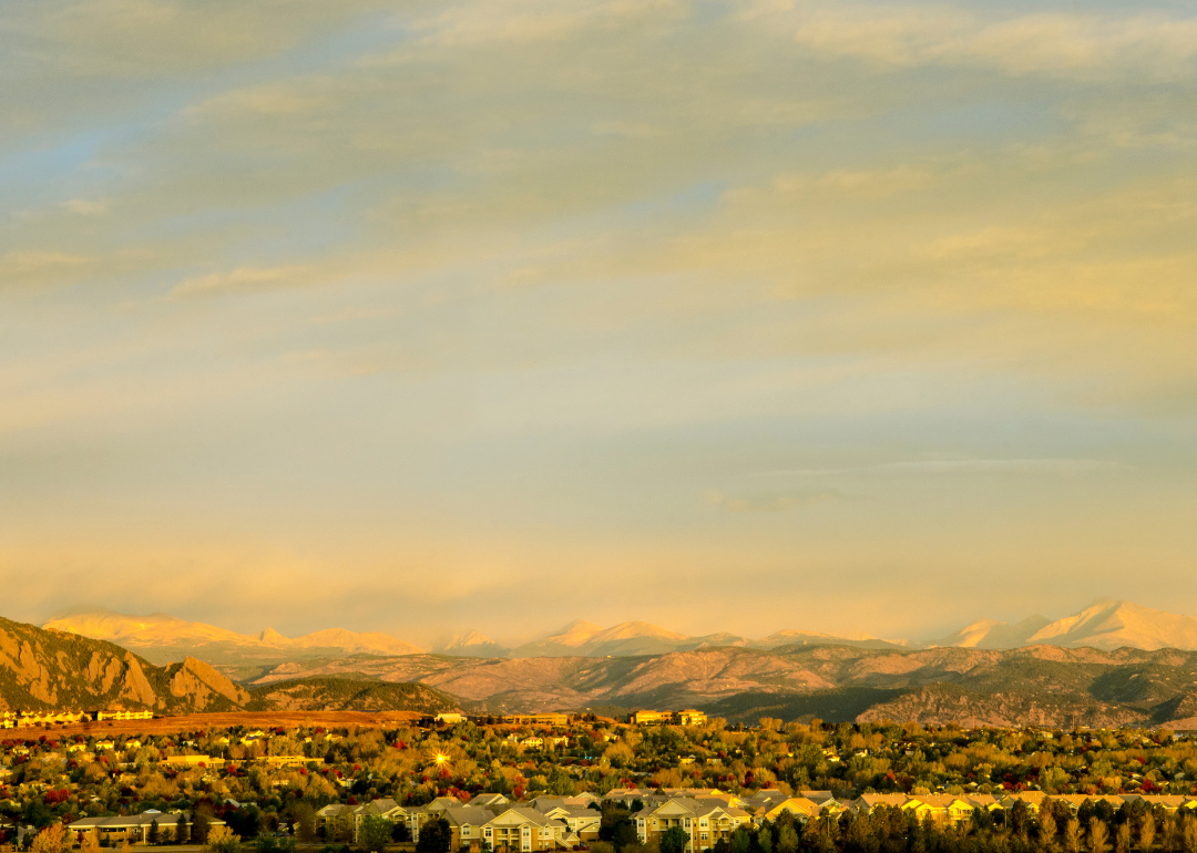  “Photograph of Broomfield County neighborhoods with mountains in the distance” - Canva