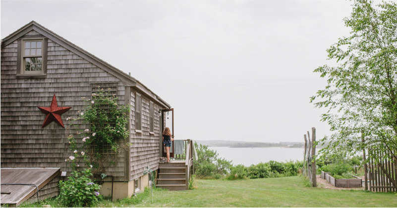 Wooden House with a Garden Facing a Lake