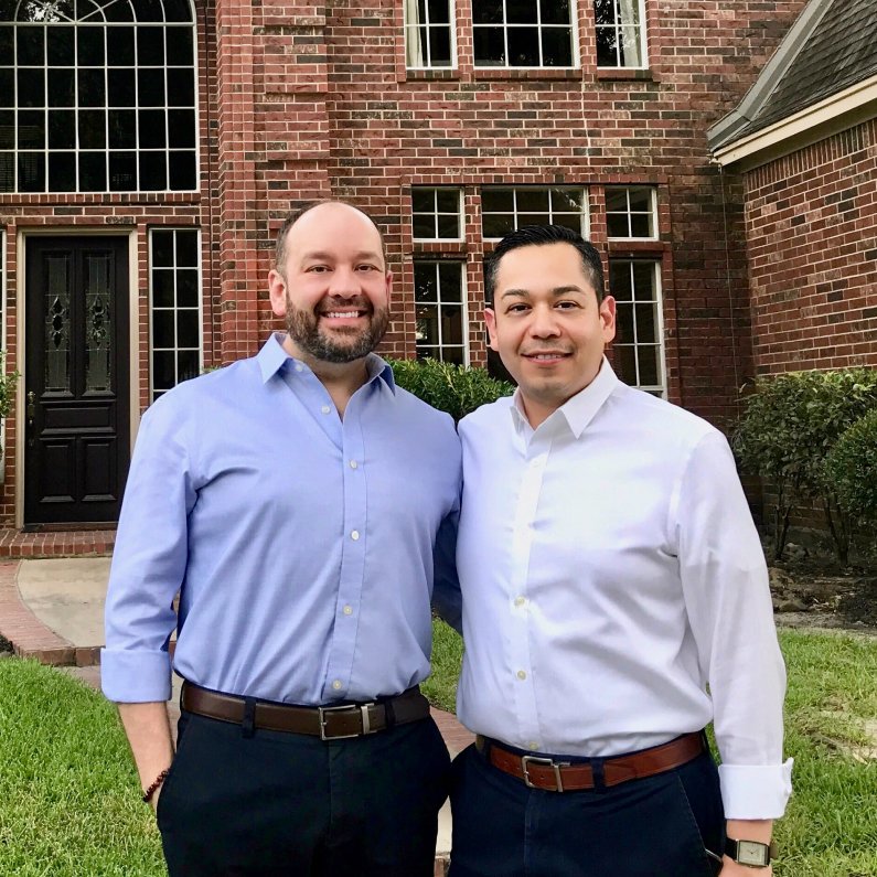 Better Mortgage Clients, Marc and David Standing Outside of Their Brick Home