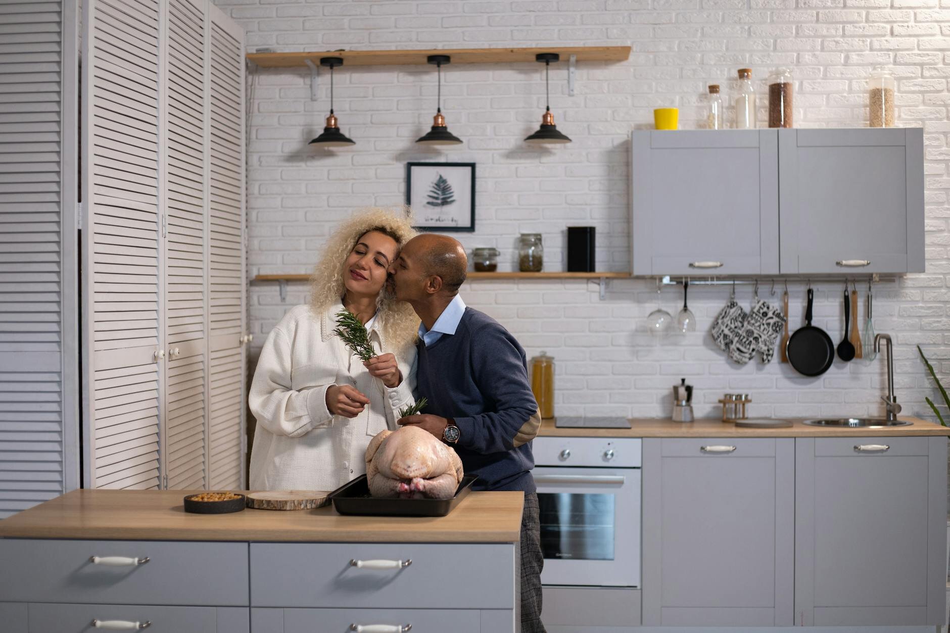 Couple in home kitchen after learning all the ways they can use their home equity