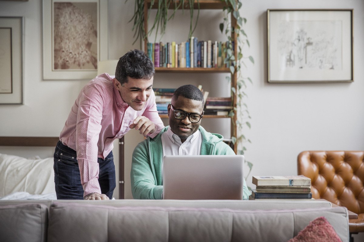 Settlement and Title Services - Two Men Looking at Laptop