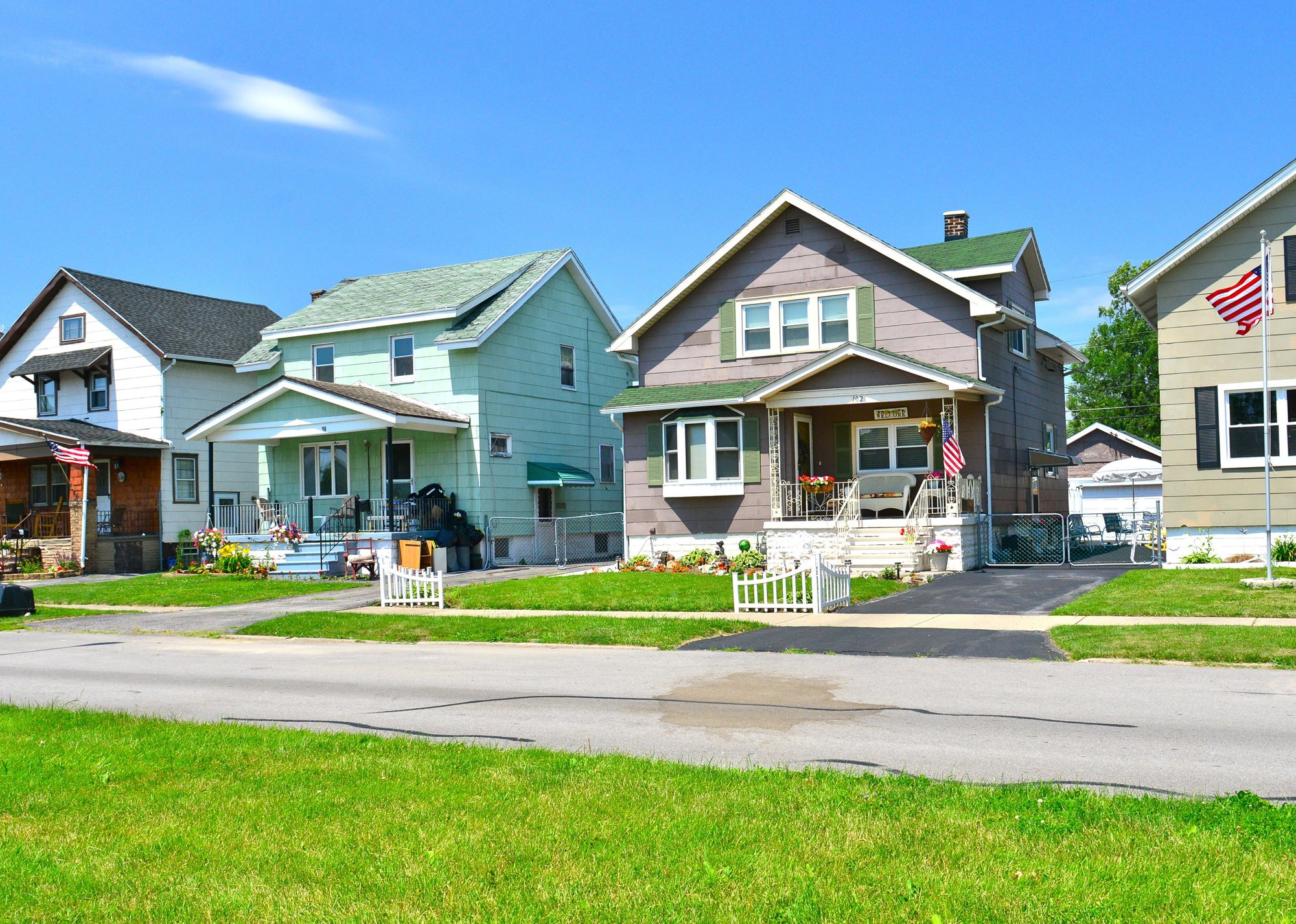 “Residential street with two story homes and lawns” - Source: Richard Cavalleri // Shutterstock