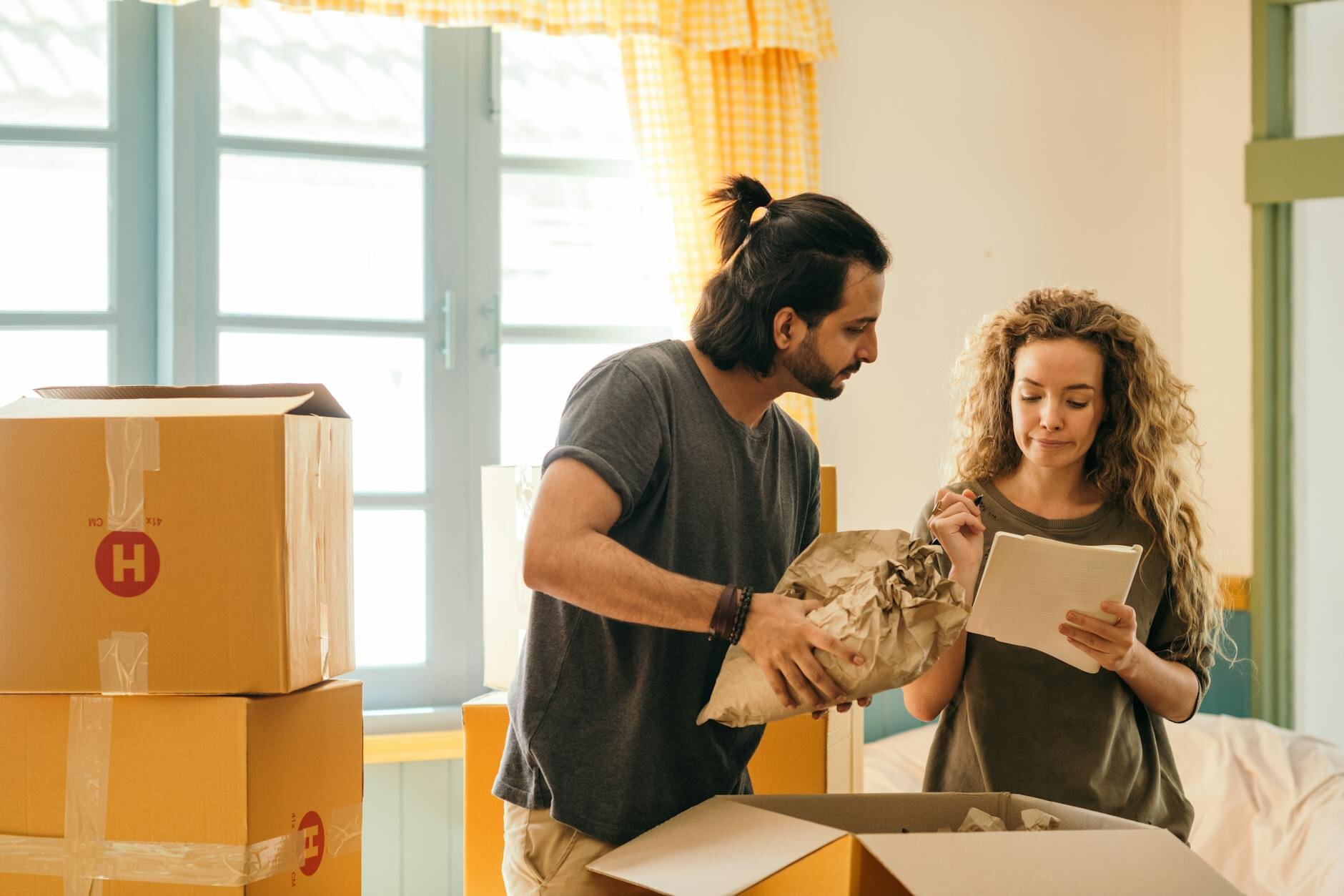 unpacking belongings in a new home bought with an FHA or VA loan