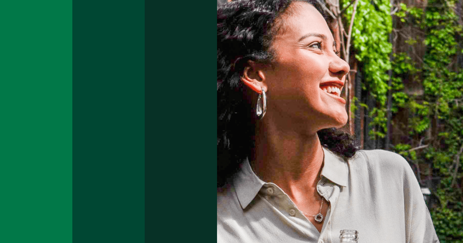 Woman smiling and looking off into the distance, with three vertical green bars on the left, reflecting on the cost to get pre approved for mortgage.