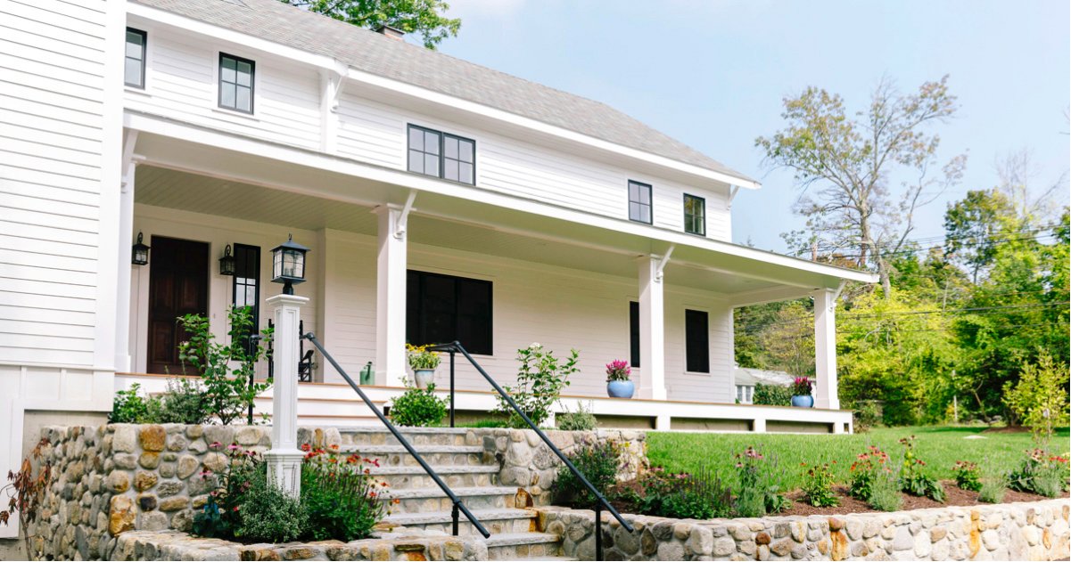 Large White Home with Green Lawn