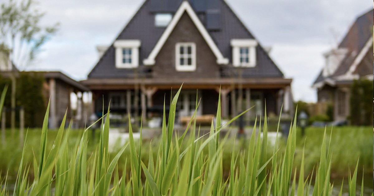 Grey House with Grass in Front of it