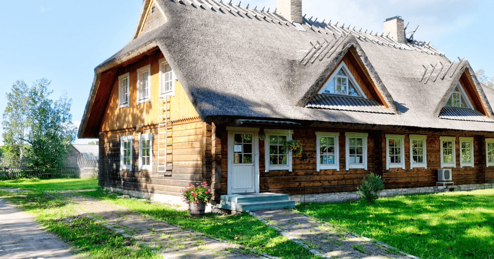 Corner Perspective of Brown-colored House With Multiple Windows on Sunny Day