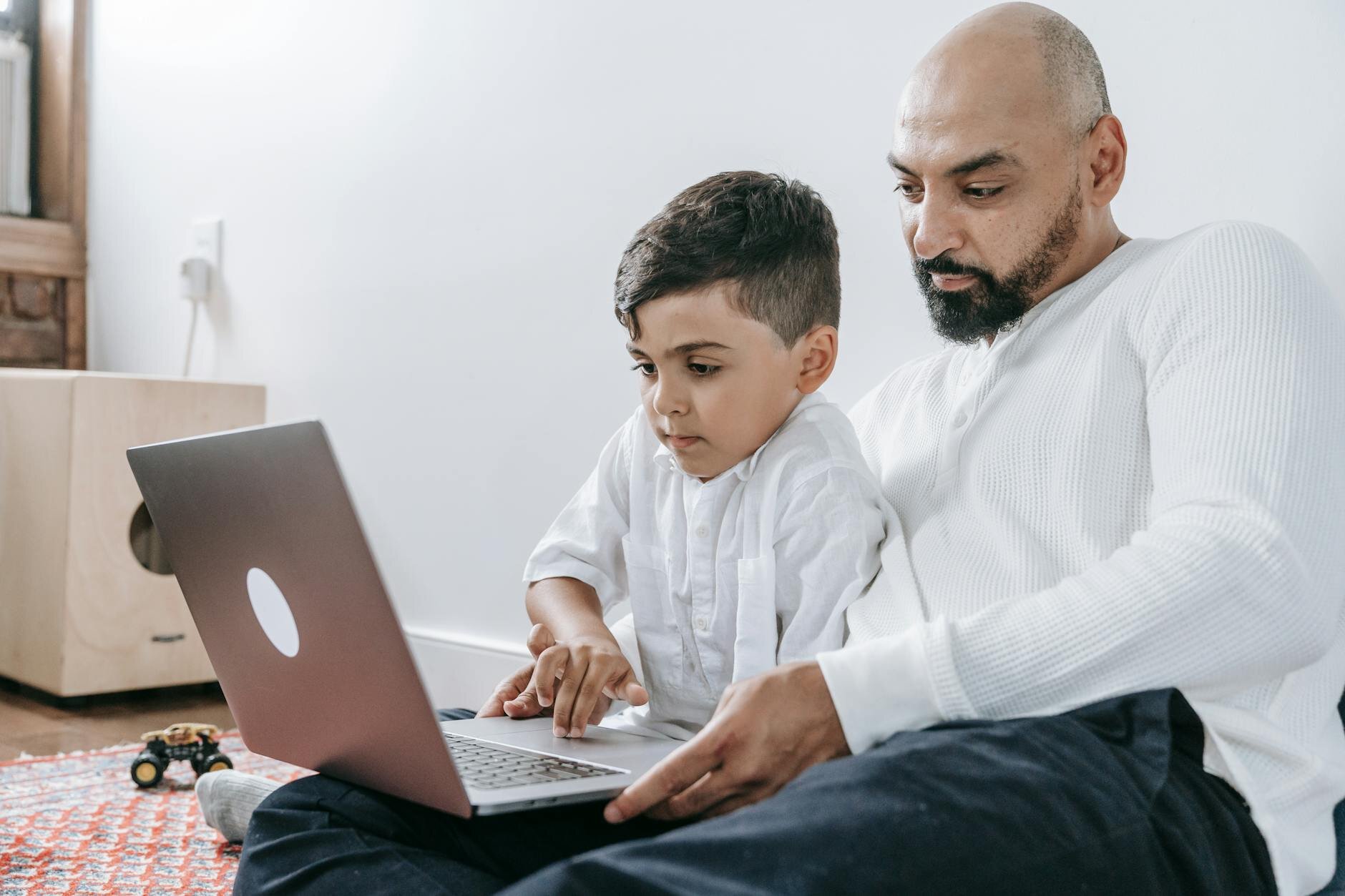 Man and son researching how HELOC payments work