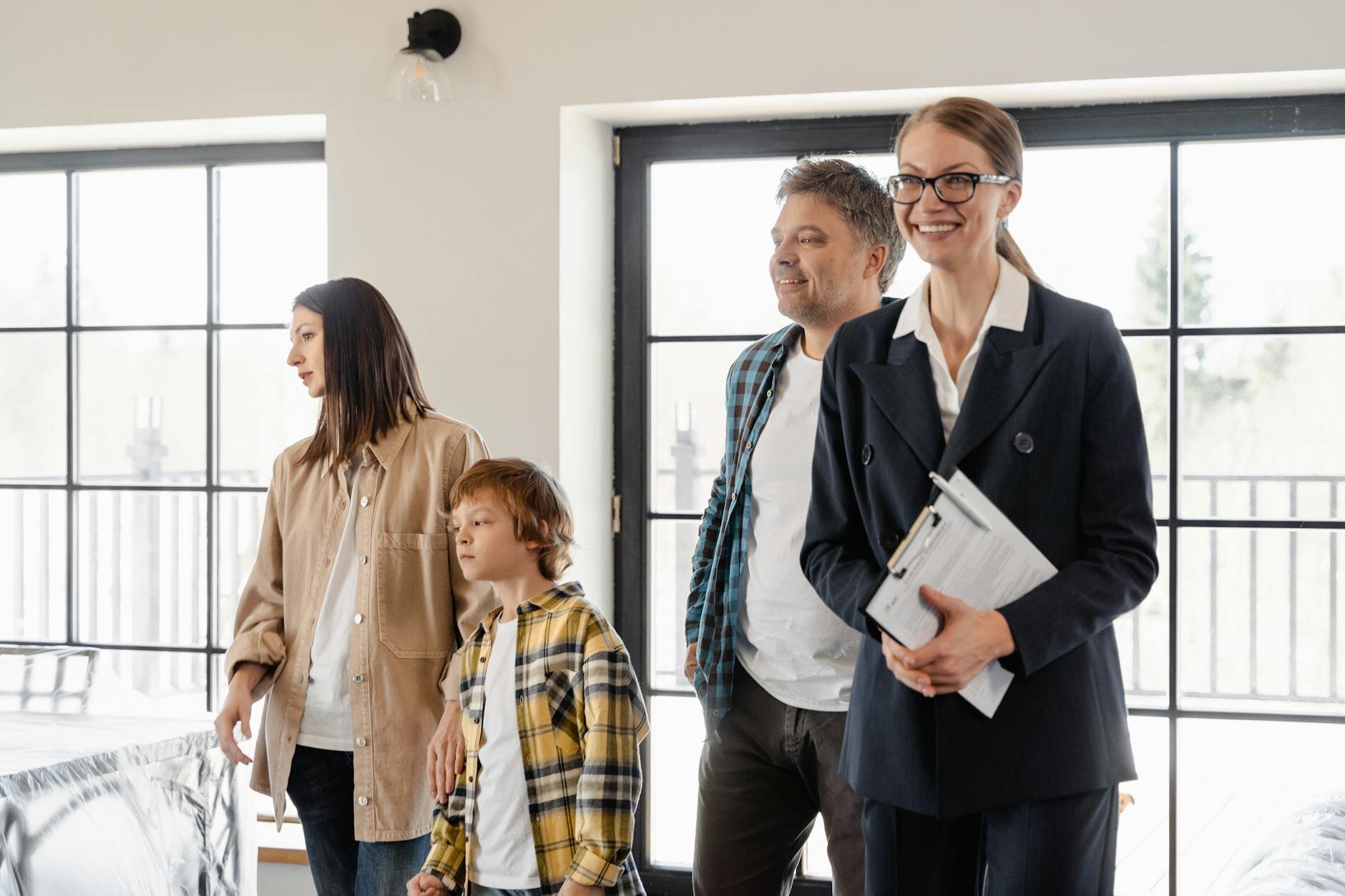 Family tours home with Realtor in advance of putting earnest money toward the purchase.