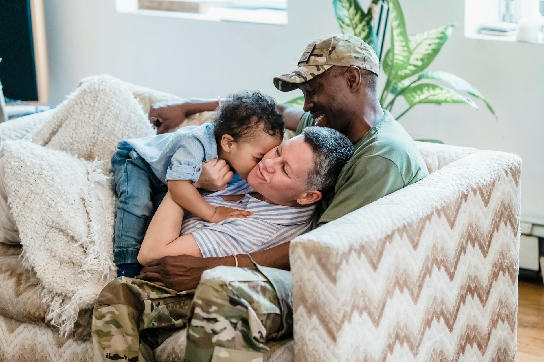 Veteran hanging with family in home after buying it with a VA loan versus a conventional one.