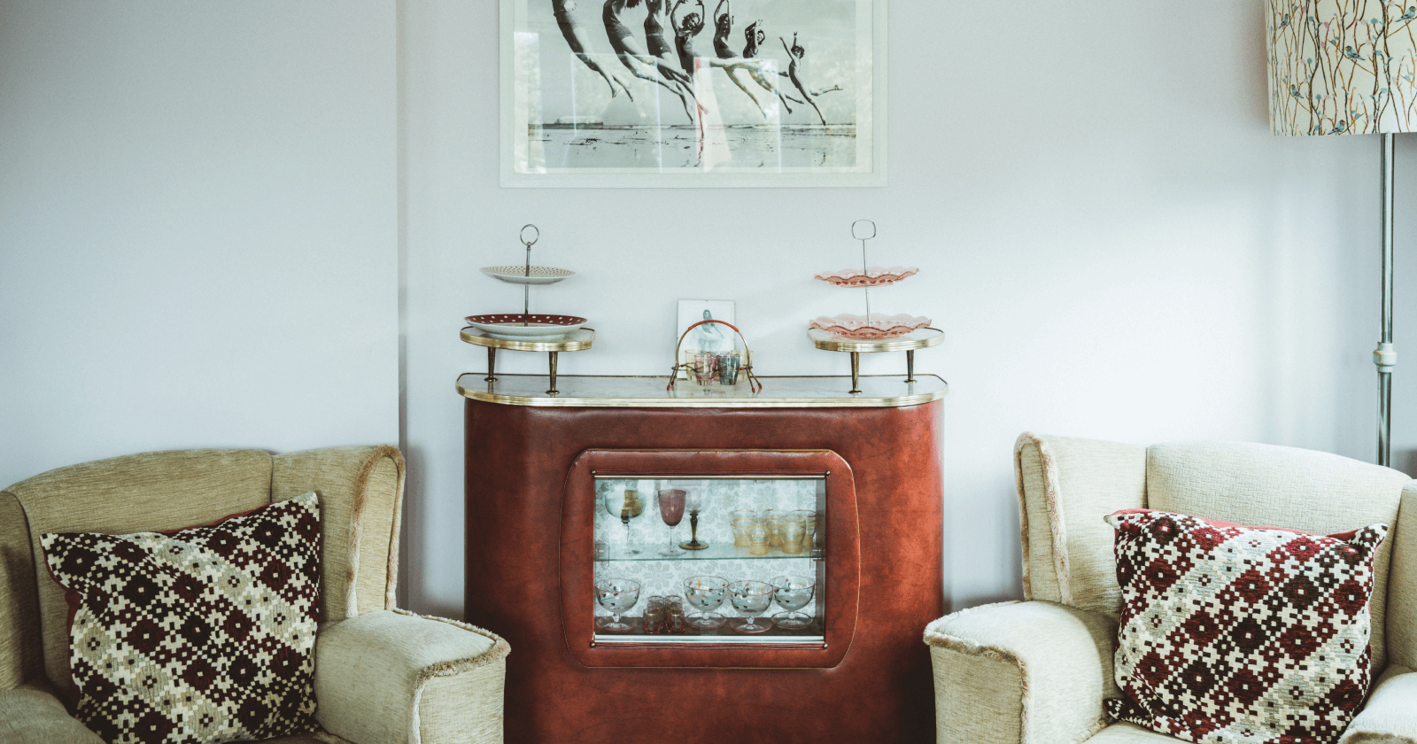 1950&#39;s Style Living Area with Two Chairs and Floor Model Television in Center