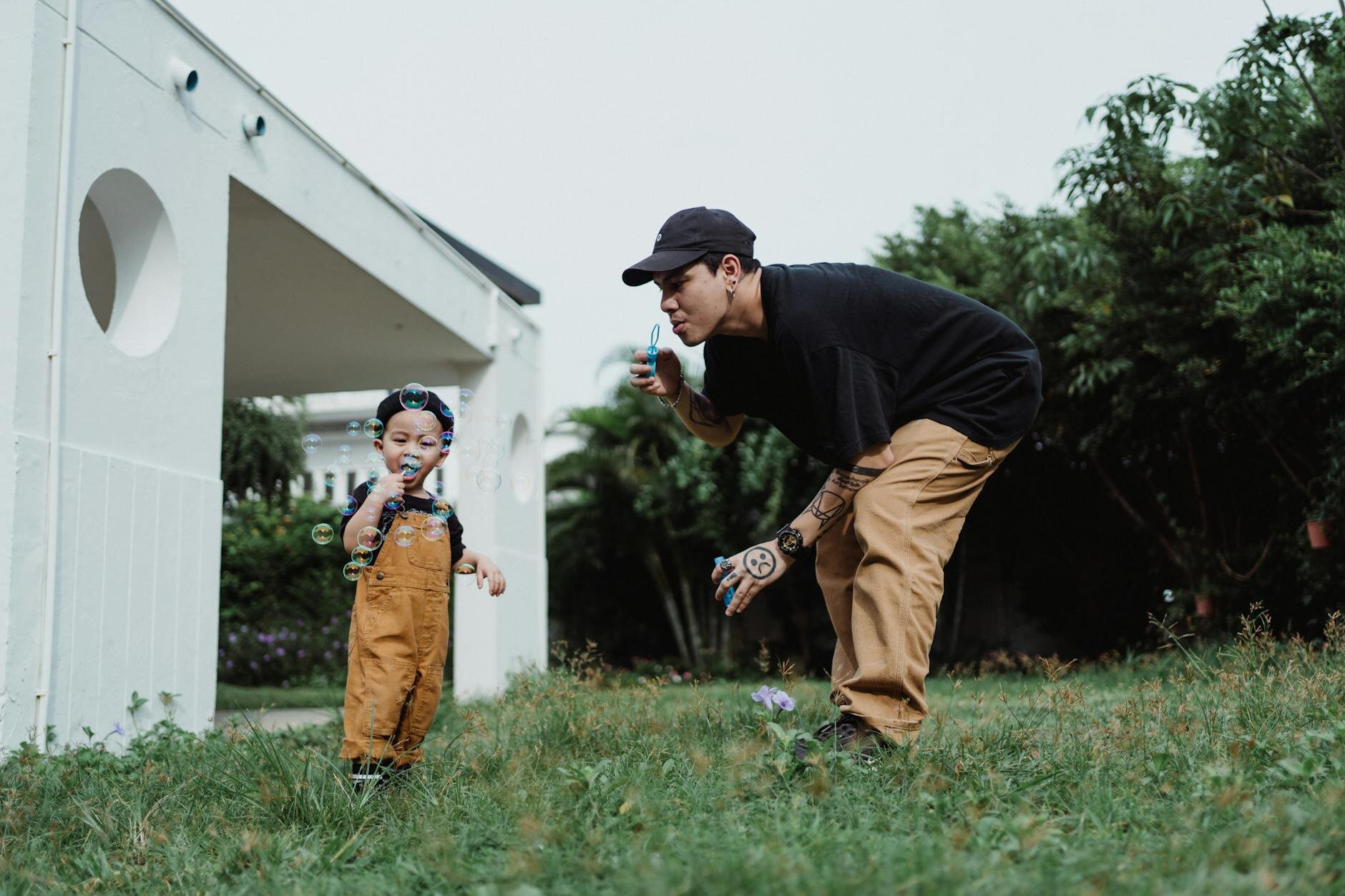 Man and child playing in backyard after learning they can increase their HELOC limit.