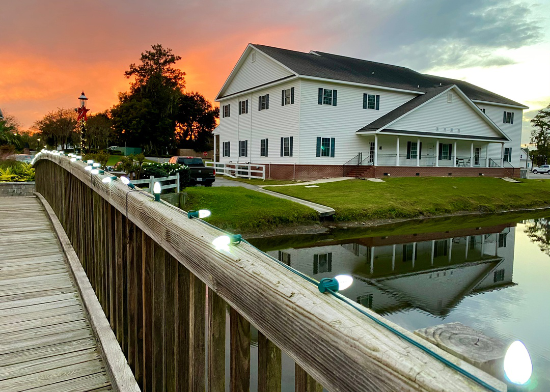  “Photograph of a two-story house overlooking a river” - Source: Kevin Chen Images // Shutterstock