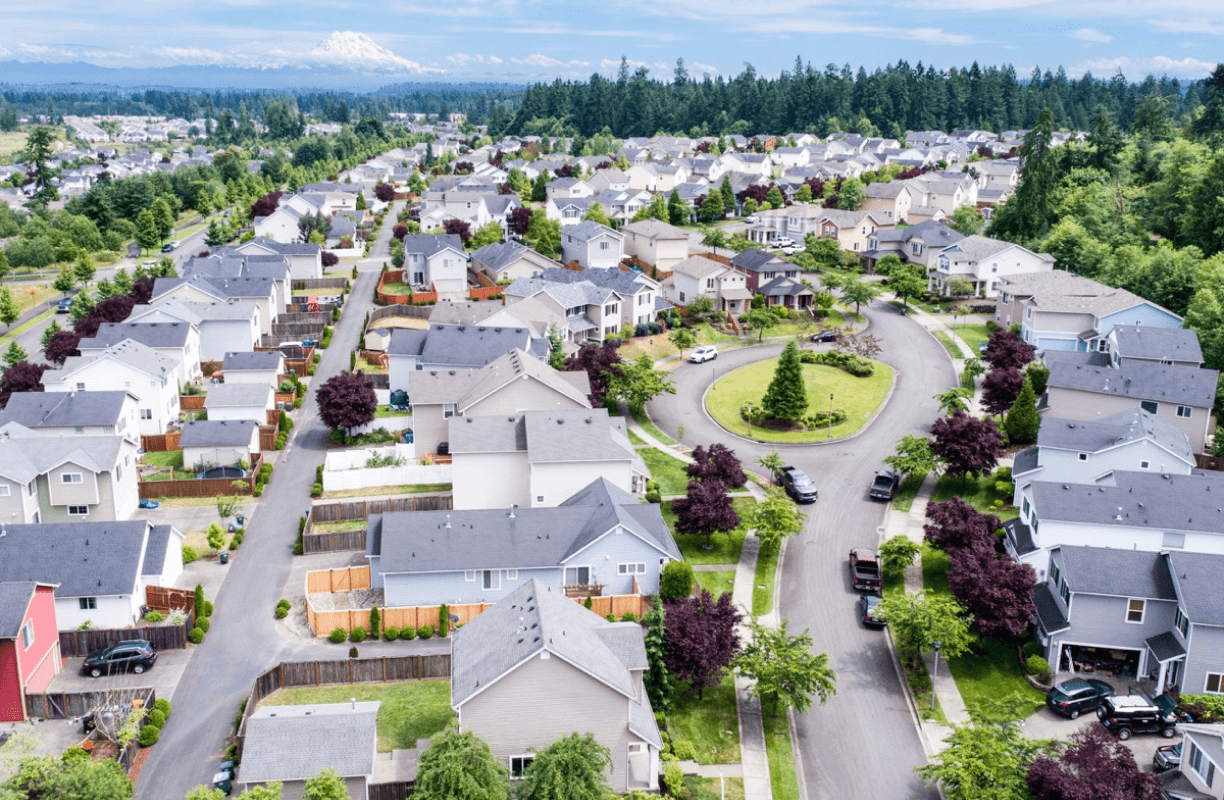 Aerial View Of Suburban Homes On Sunny Day
