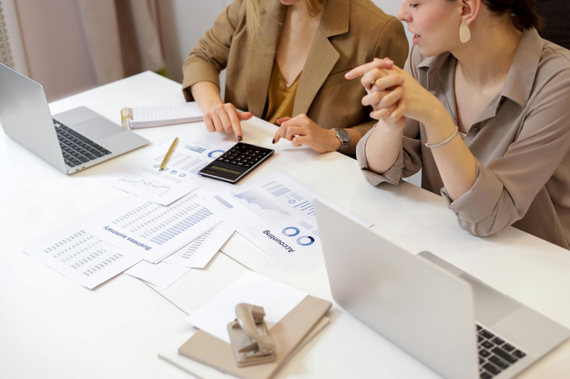 Manual underwriters analyzing a loan application.