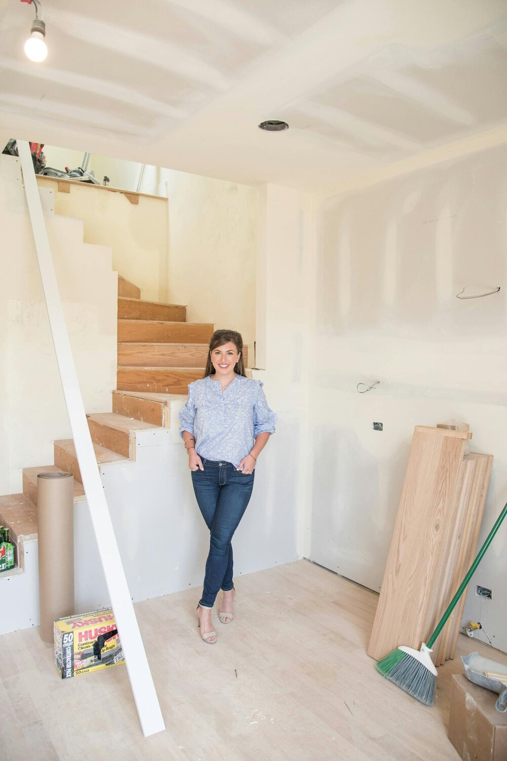 Jen in front of stairs.