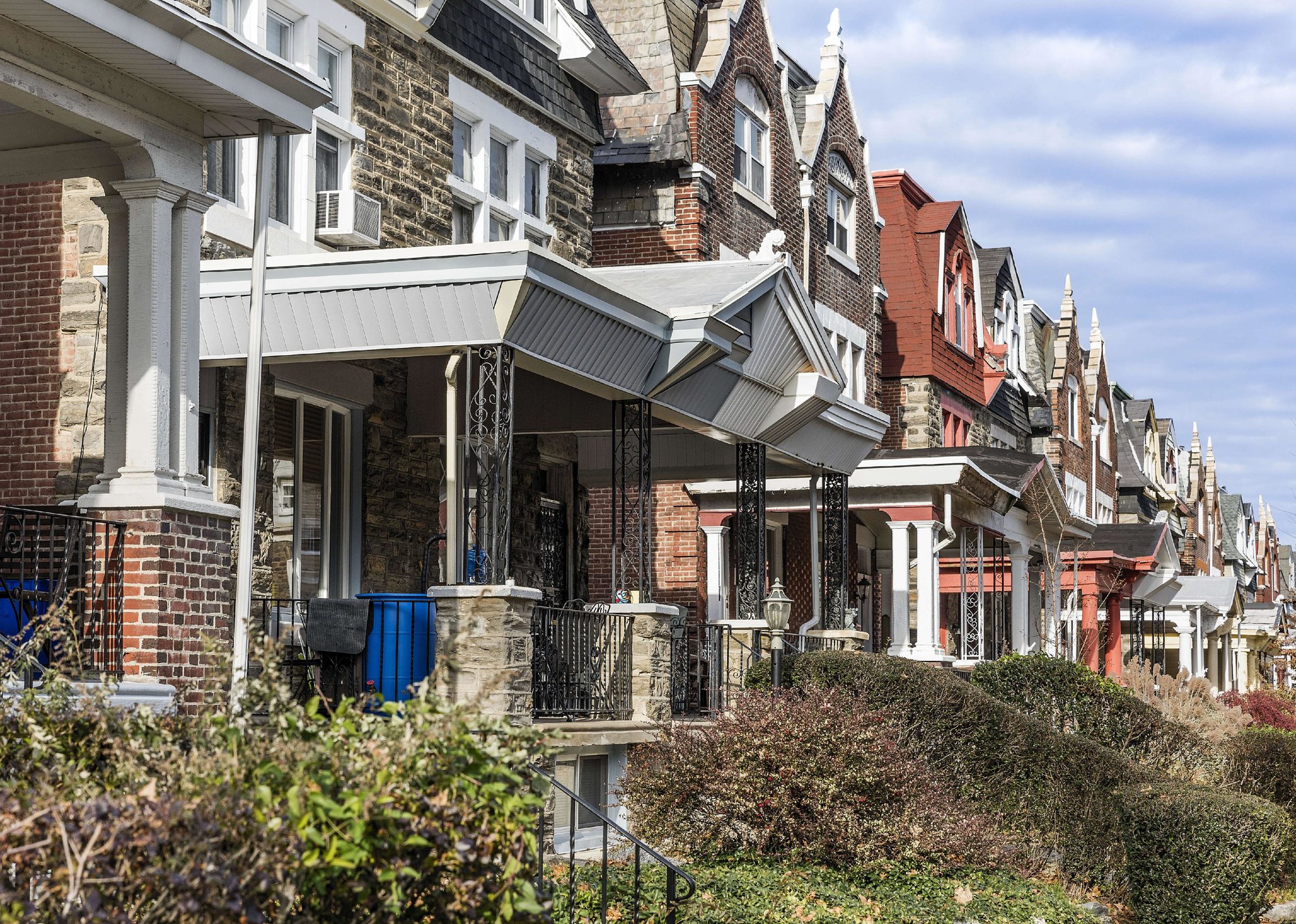 Row homes with covered porches - Source: John Greim/LightRocket // Getty Images