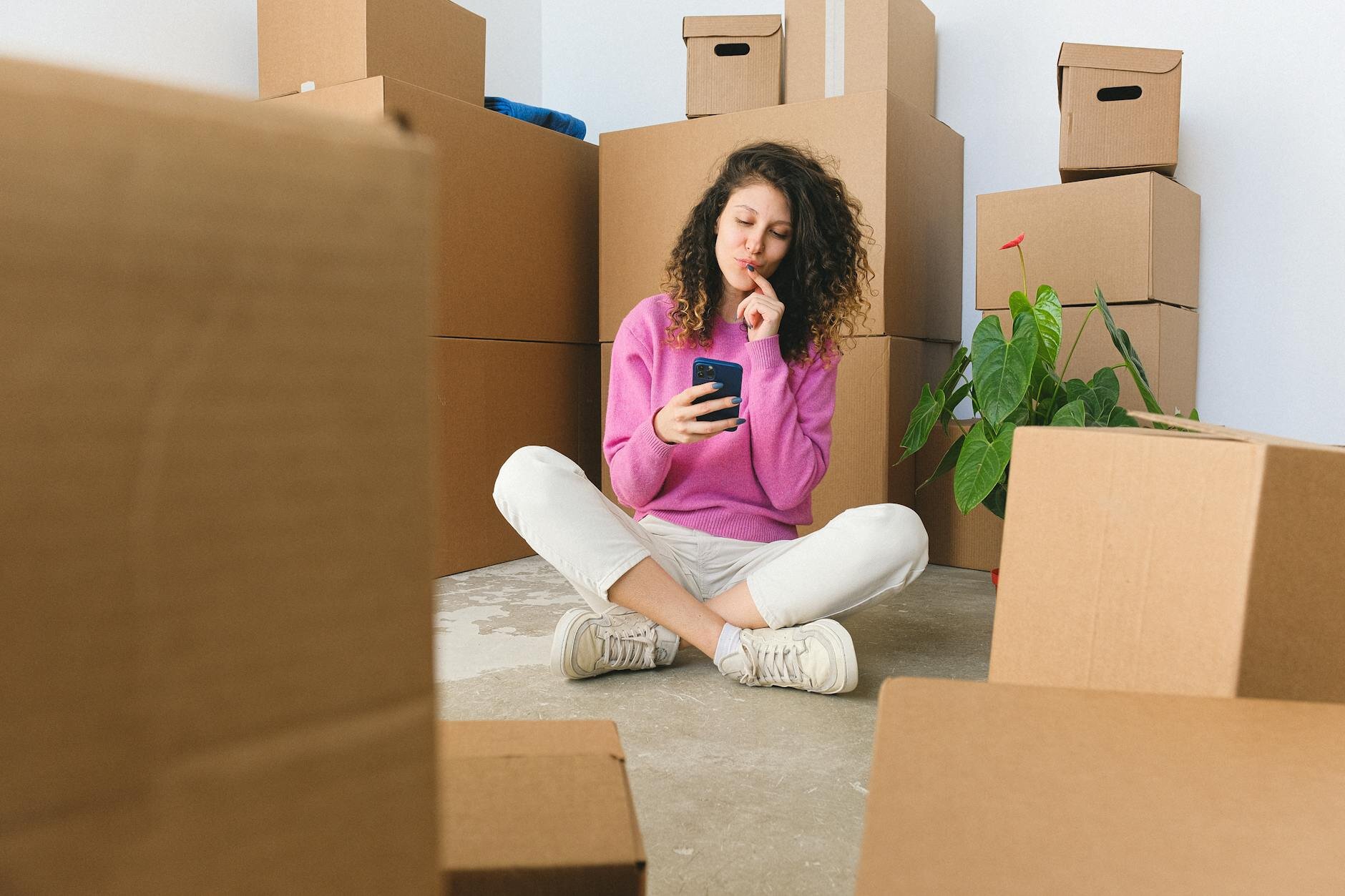 Women finds her mortgage maturity date on her phone.