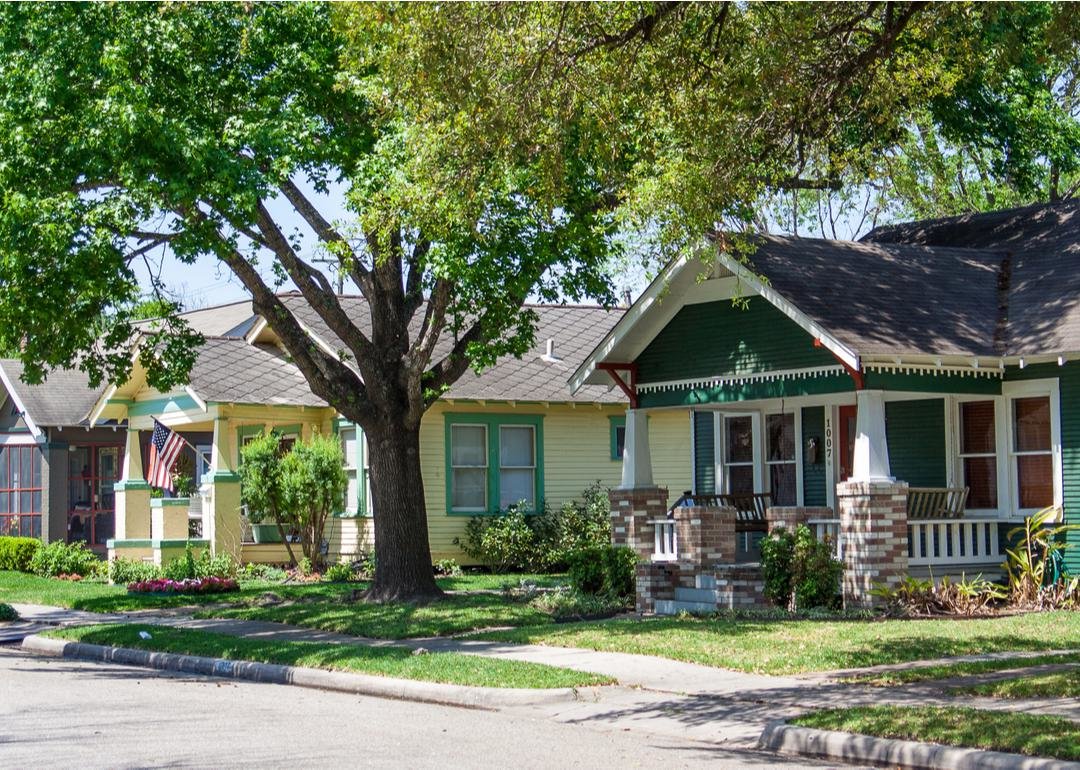 Row of 1-story homes with front porches - Source: Stephanie A Sellers // Shutterstock