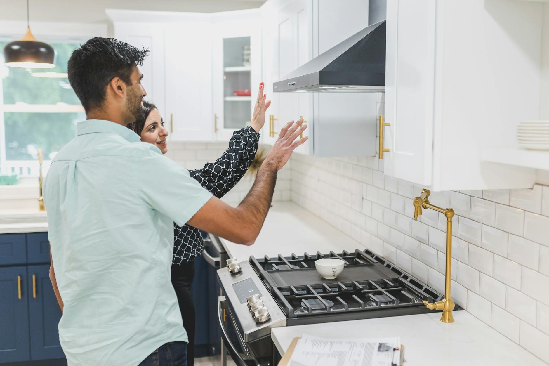 Couple exploring their new home after buying down the interest rate on their mortgage