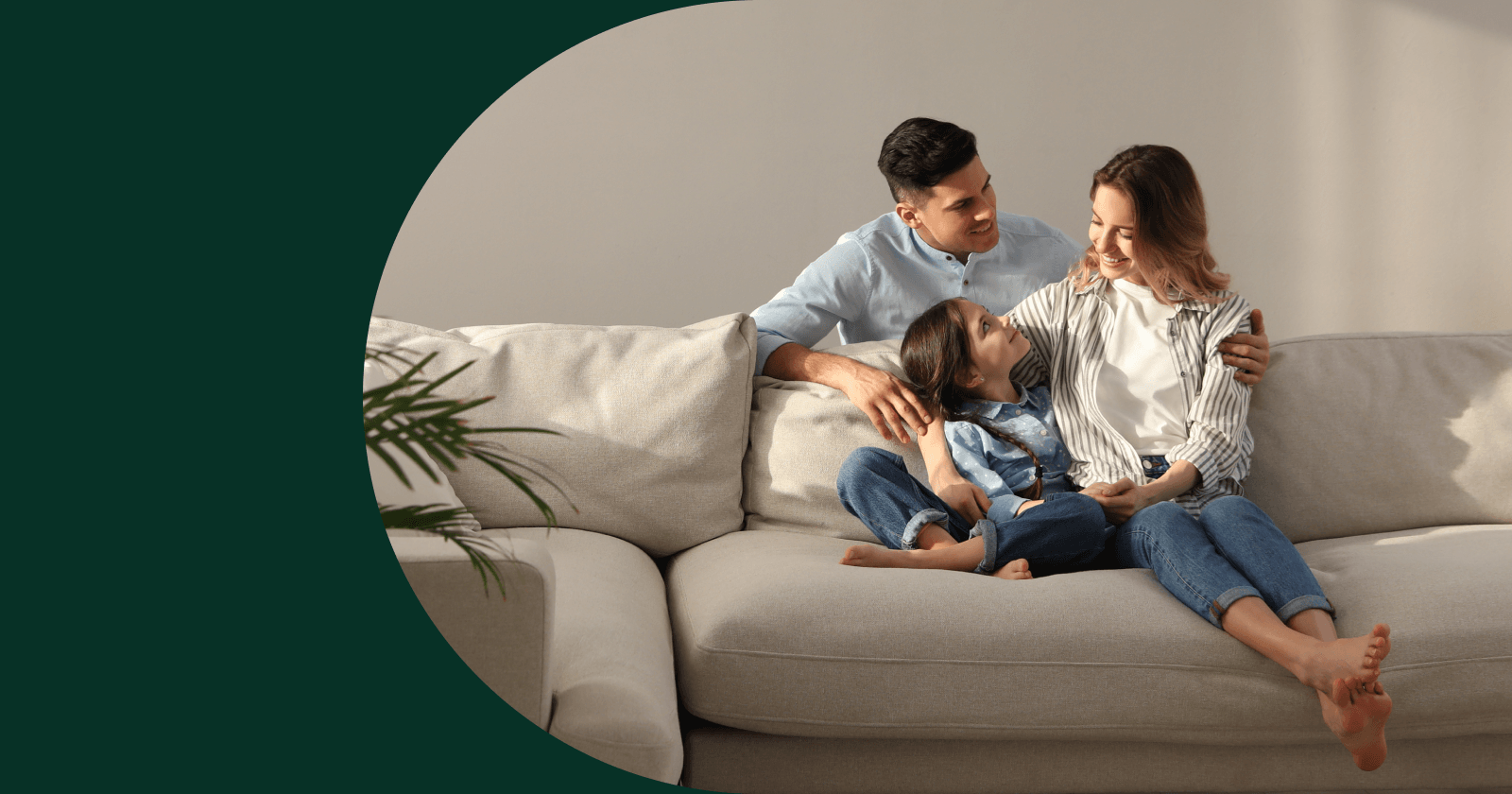 Elliptical Shaped Photo of Family of Three Inside Dark Green Background