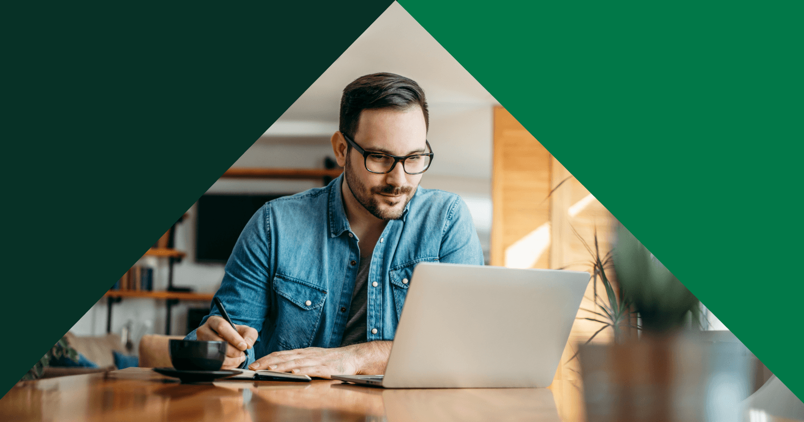 Triangular Shaped Photo of Person Taking Notes in Front of Laptop