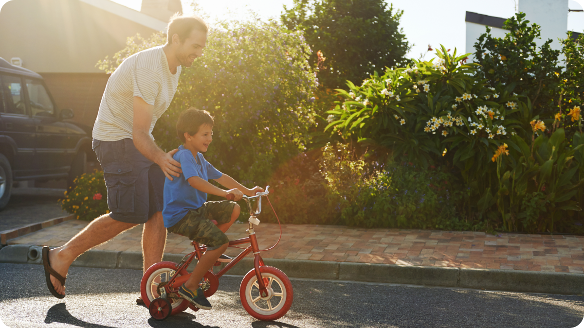 Family enjoying the neighborhood of their new home after negotiating their mortgage rate.