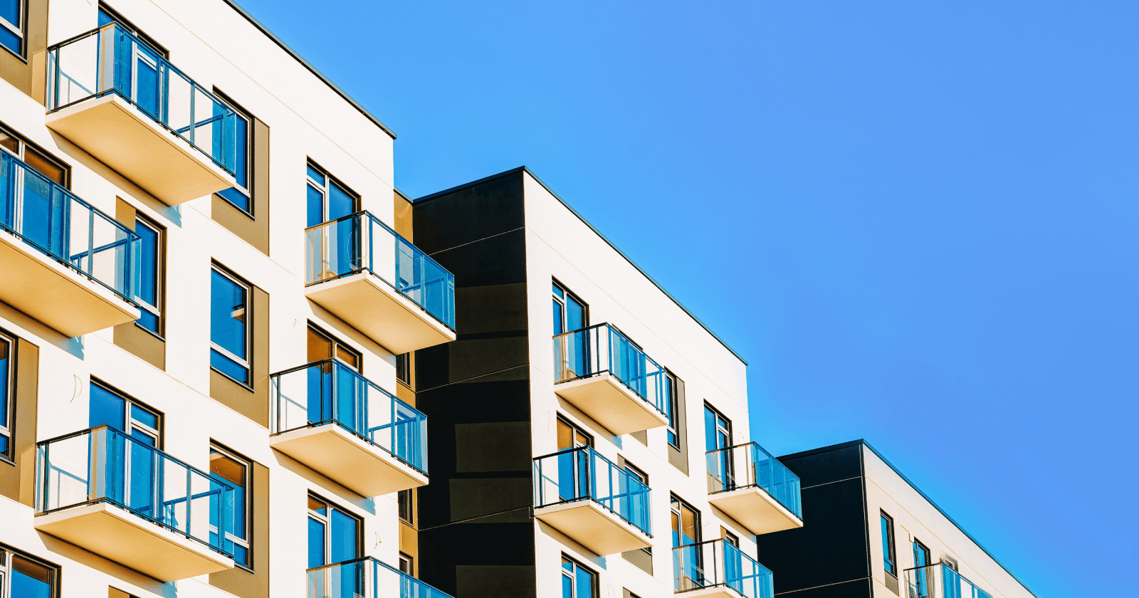 Row of Condo Homes Against Blue Sky