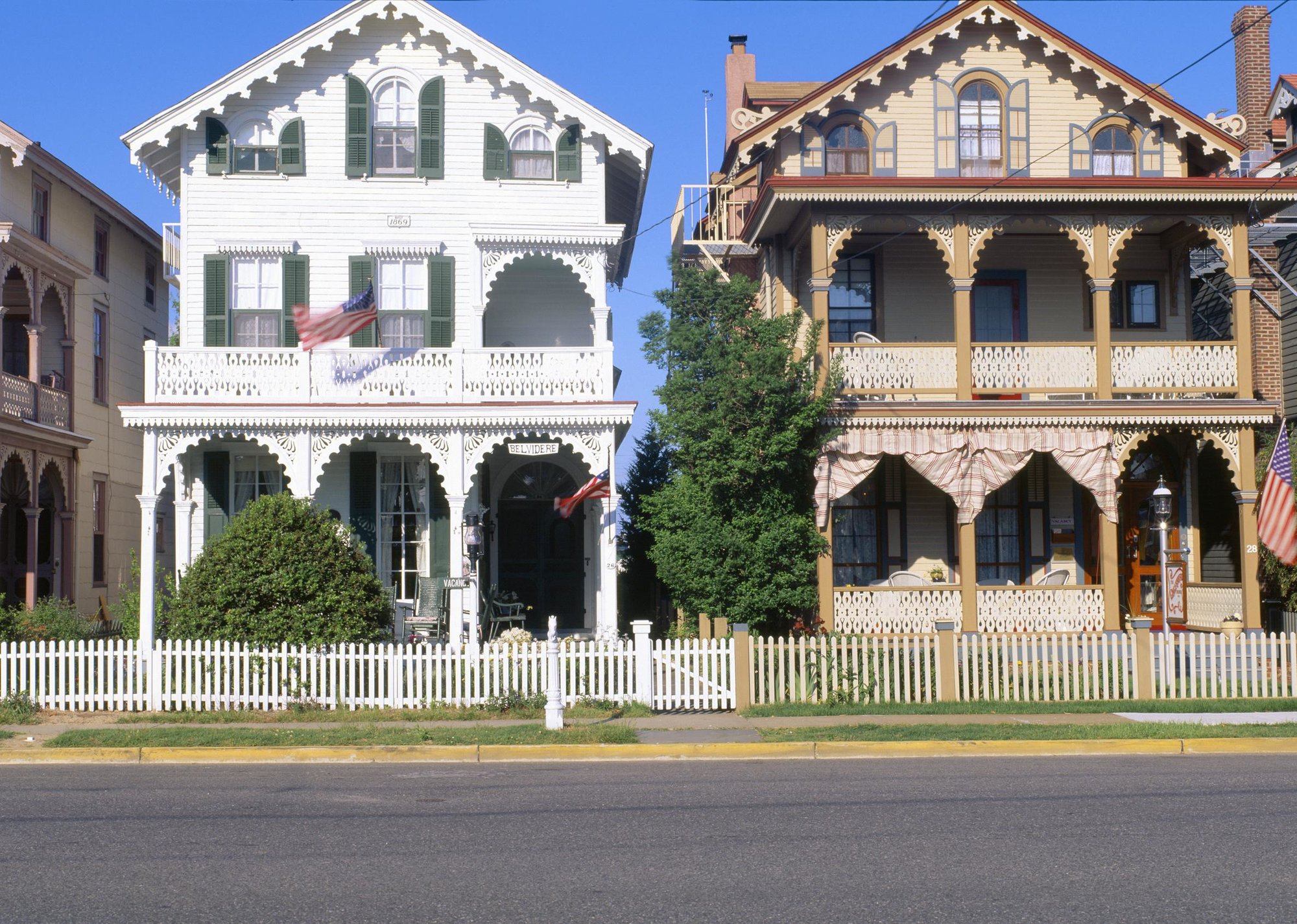 Side by side three-story homes with awning and deck wood details” - Source: Joe Sohm/Visions of America/Universal Images Group // Getty Images