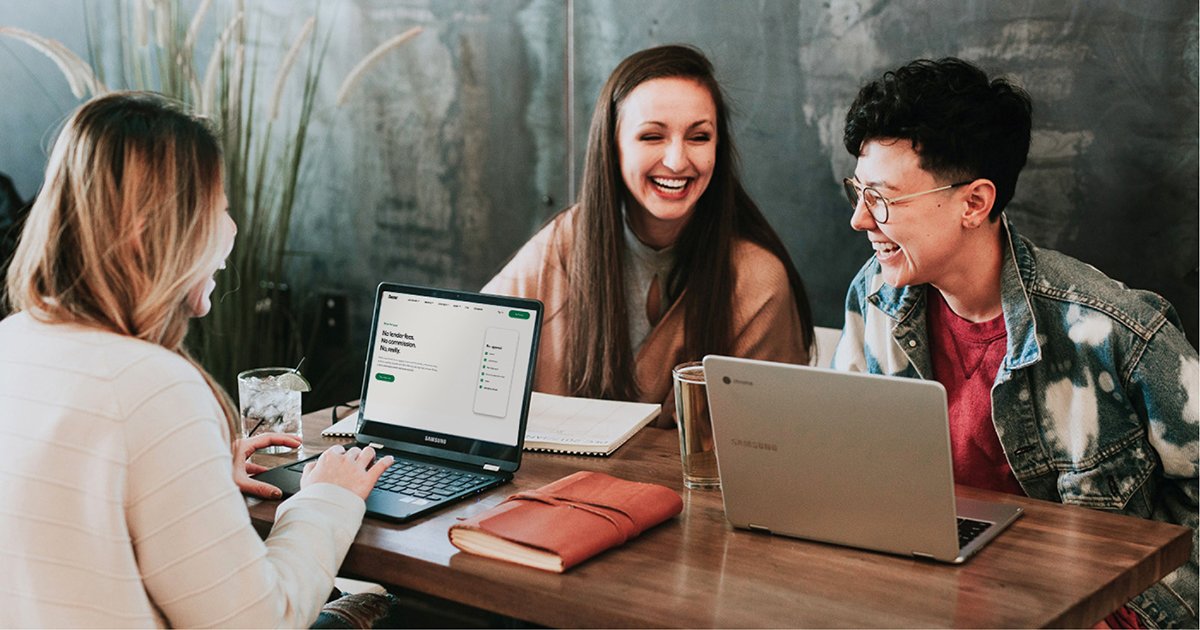  A Group of Three Laughing While on Their Computers and Browsing Better.com