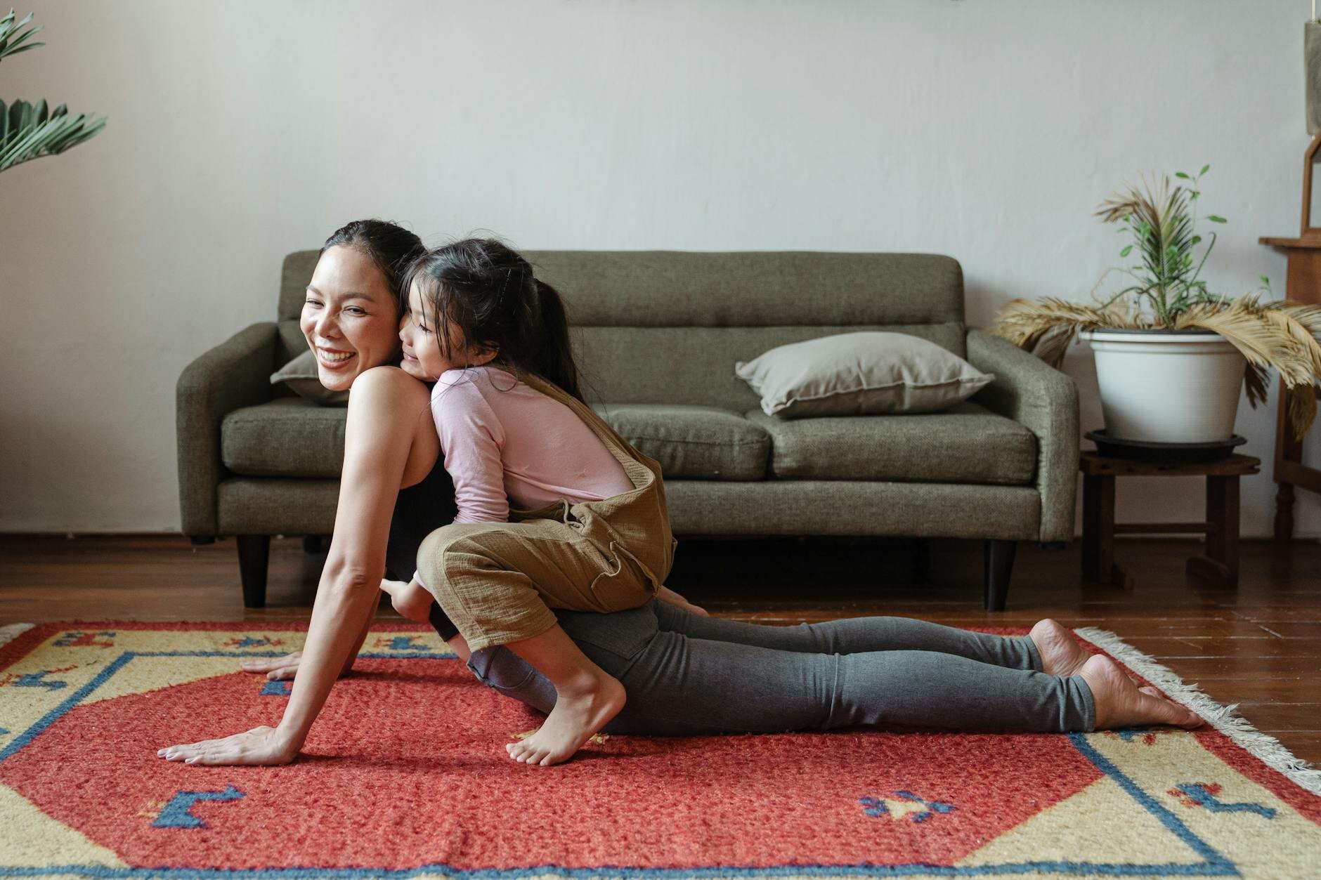 Mother playing with daughter in home after getting equity out of home without refinancing