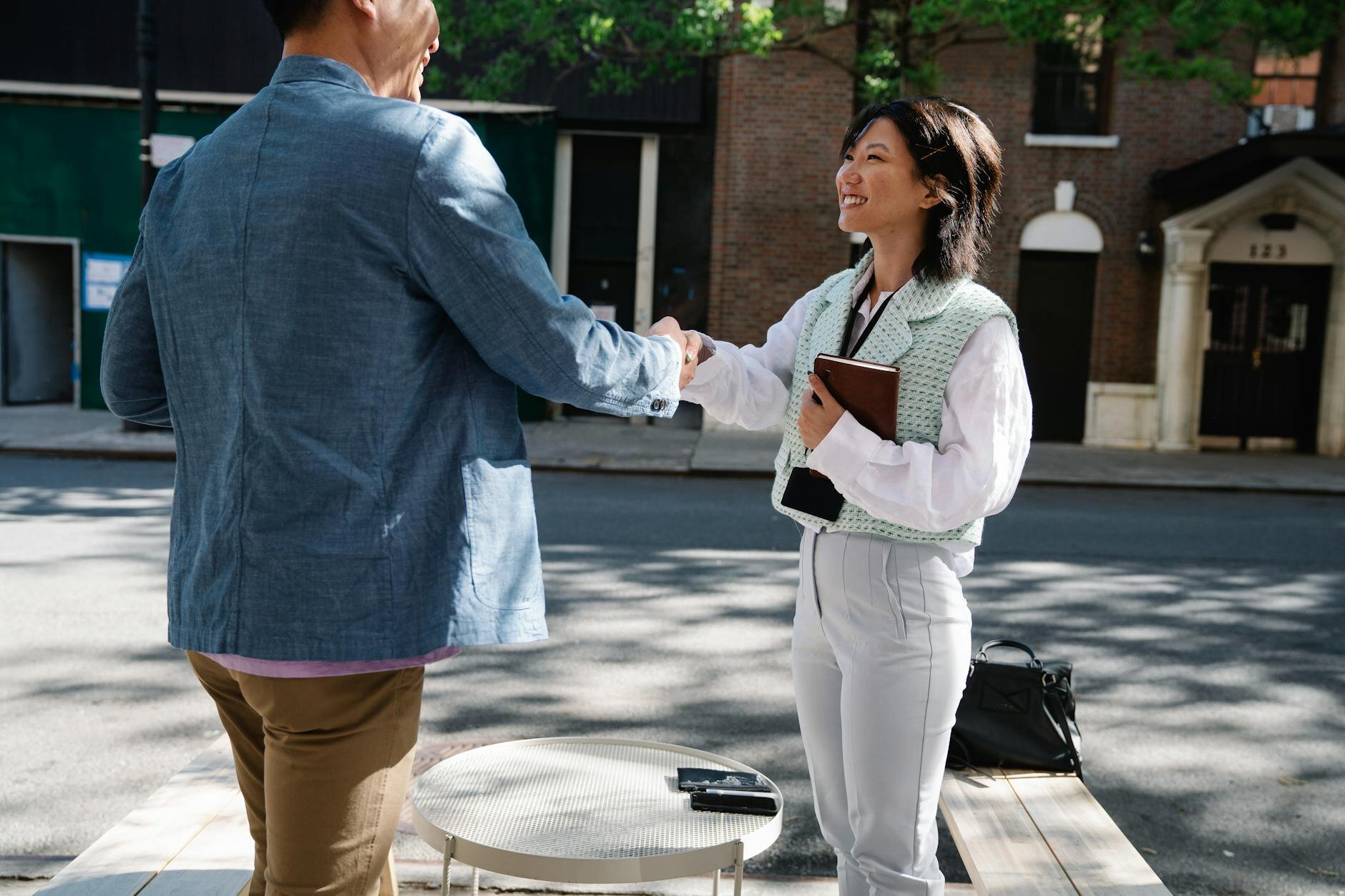 Two people shaking hands after making a deal — how does an assumable mortgage work