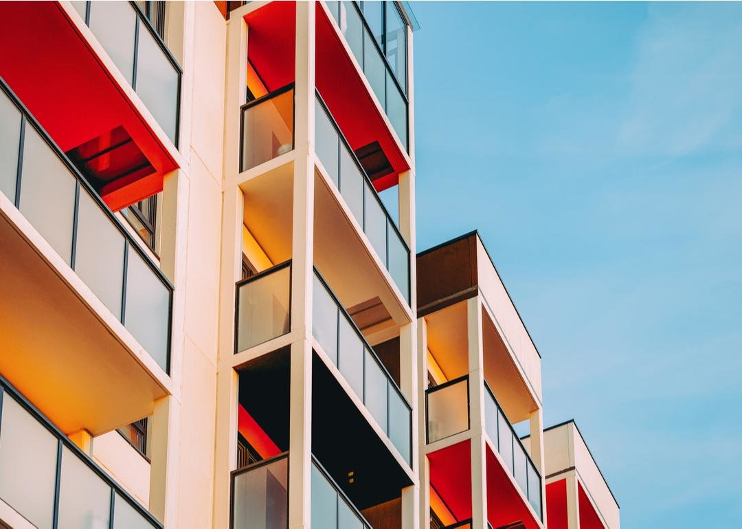 Modern-style balconies shot looking up at their multi-color bases - Source: Roman Babakin // Shutterstock