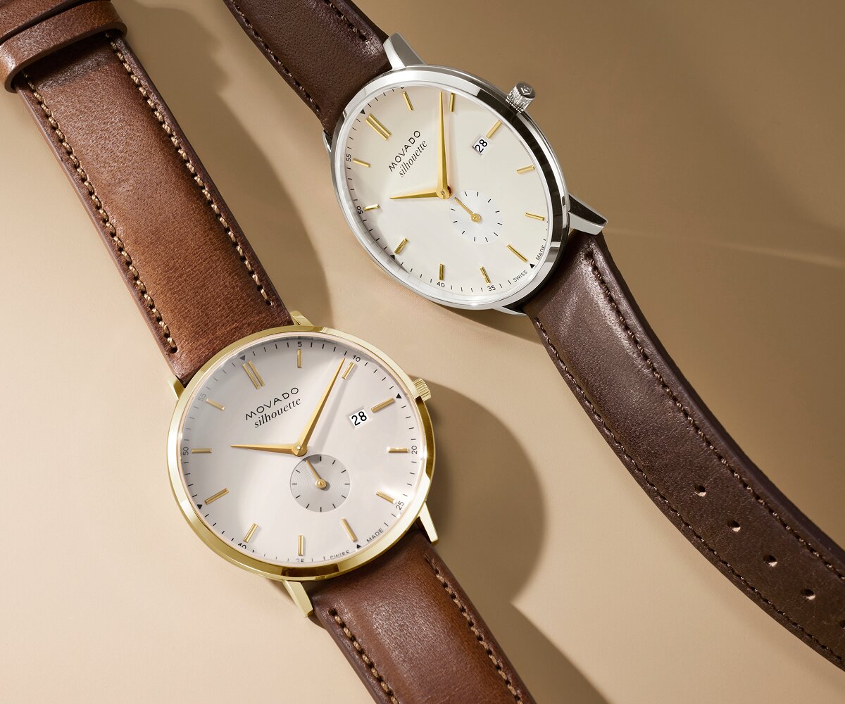 Heritage Silhouette watch with light brown leather strap and white dial next to the Heritage Silhouette watch with dark brown leather strap and white dial.