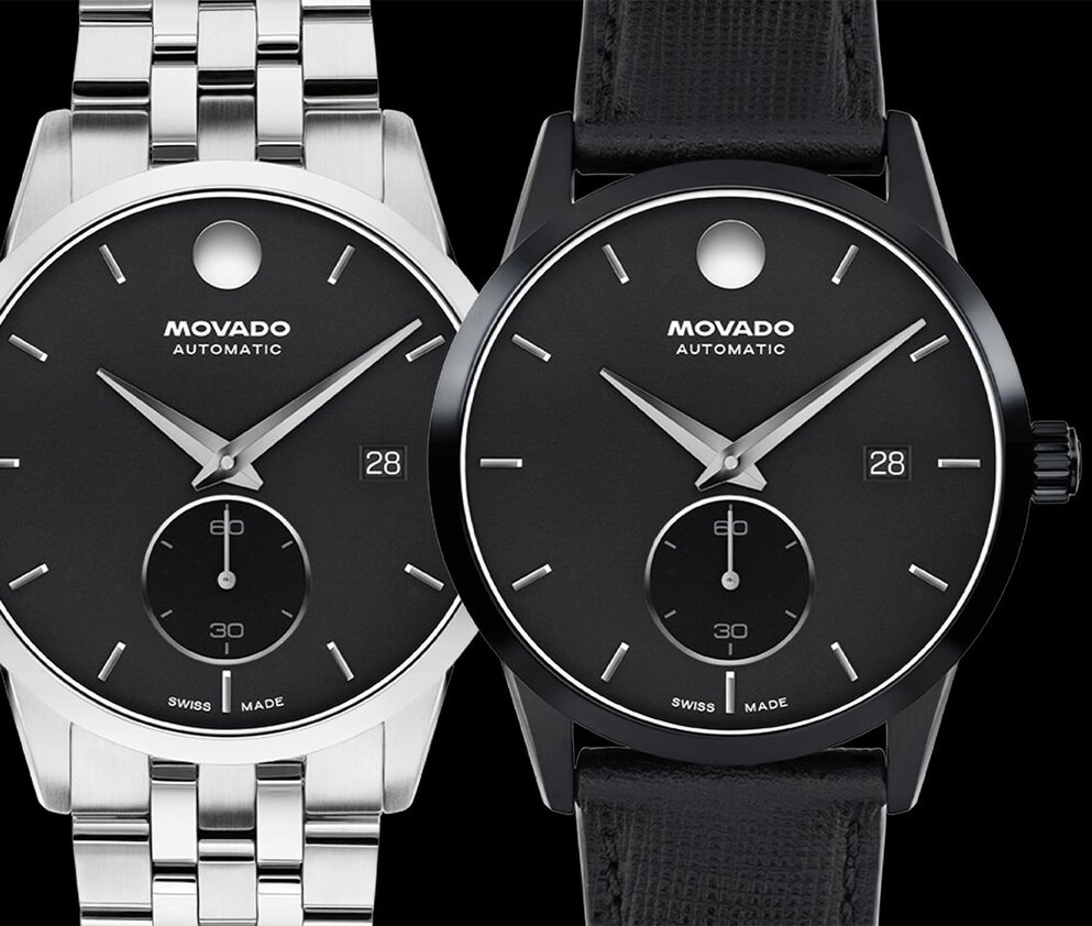 Museum Taga watch with stainless steel bracelet and black dial next to Museum Taga with black leather strap and dial.