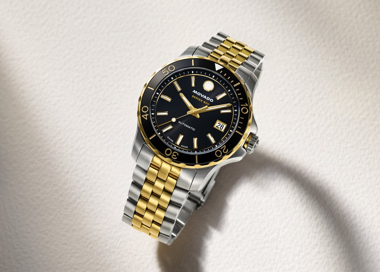Two tone Series 800 bracelet watch with black dial.