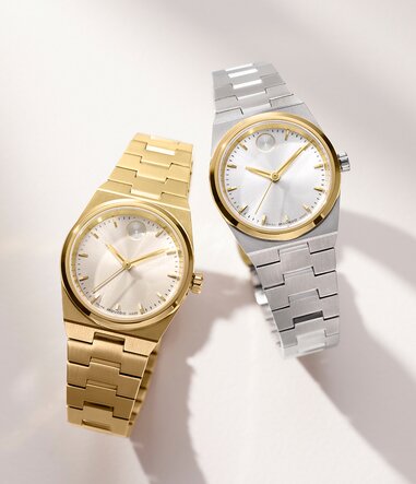 Gold tone BOLD Quest Mini bracelet watch next to a Stainless steel BOLD Quest Mini bracelet watch with gold accents.