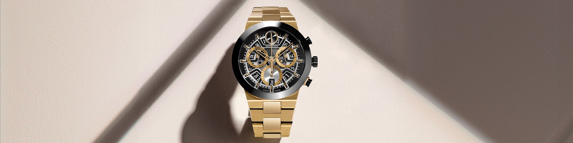 BOLD Fusion Chronograph watch with gold tone bracelet and black and gold skeleton dial.