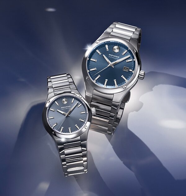 Men's and Women's Museum Imperiale watches with stainless steel bracelets and blue dials.
