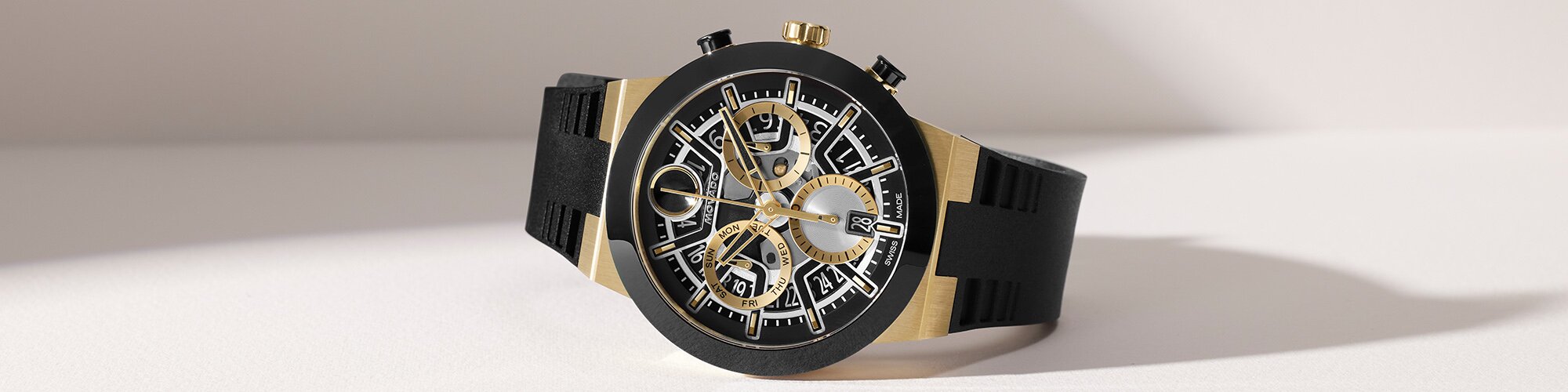 BOLD Fusion watch with black rubber strap and silver and gold skeleton dial.