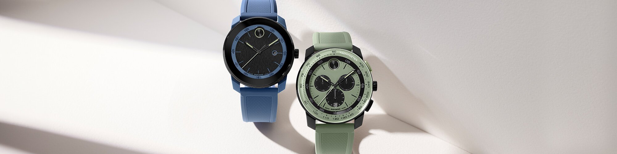 BOLD TR90 watch with blue rubber strap and black dial next to a green BOLD TR90 watch with chronograph dial.