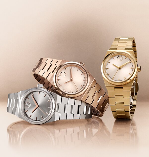 Silver BOLD Quest bracelet watch laying under a rose gold tone BOLD Quest bracelet watch with a gold tone BOLD Quest bracelet watch next to them