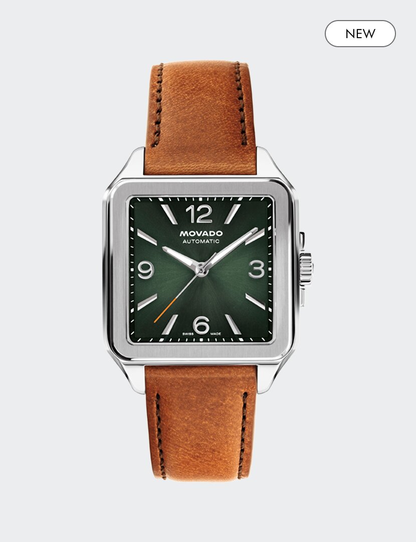 Heritage 1917 watch with brown strap and green square dial and "new" badge in the top right corner.