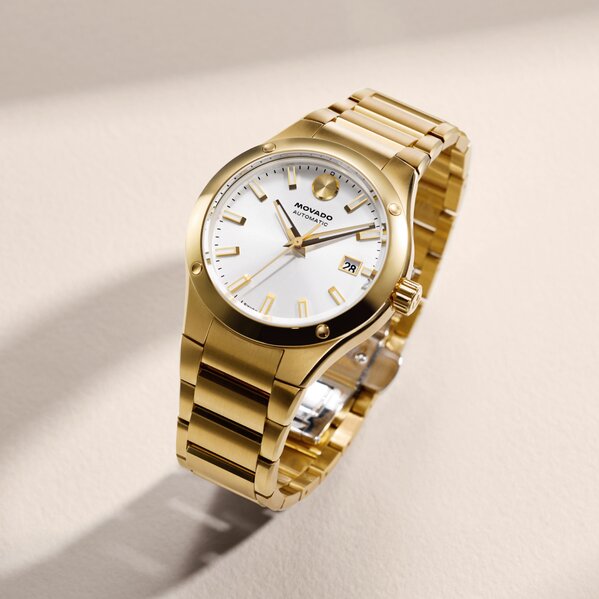 Gold tone Museum Imperiale bracelet watch with silver dial.