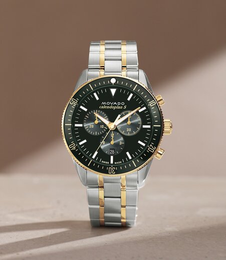 Calendoplan S two tone bracelet watch with green chronograph dial.