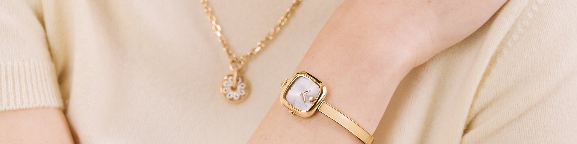 3 gold tone museum bangle watches each with a different dial shape; circle, square and oval