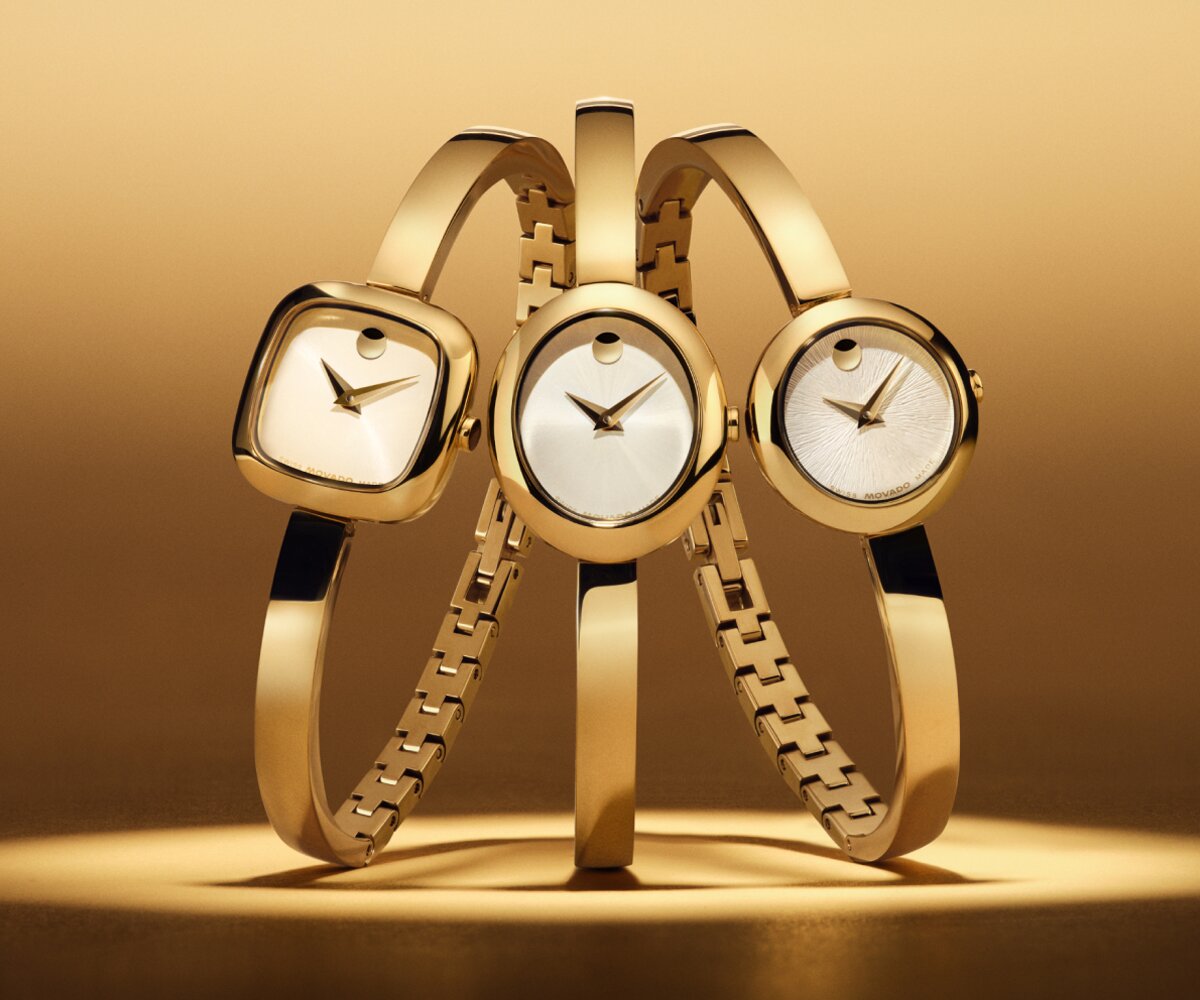 Gold tone Museum Bangle with a circle dial, next to a, Gold tone Museum Bangle with a square dial, next to a, Gold tone Museum Bangle with an oval dial.