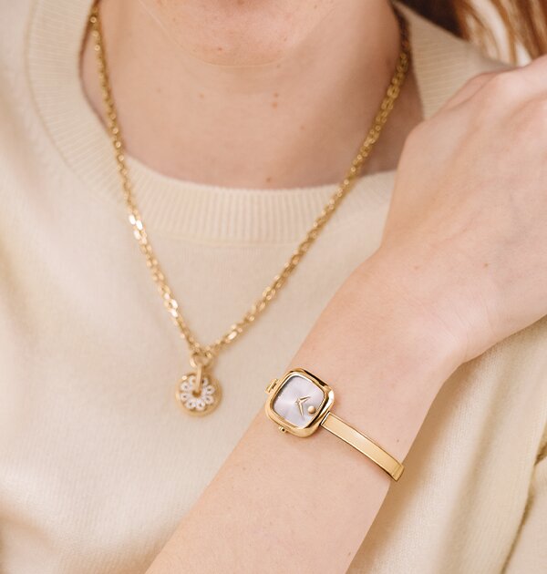 3 gold tone museum bangle watches each with a different dial shape; circle, square and oval